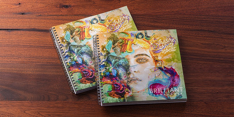 Brightly coloured spiral bound books