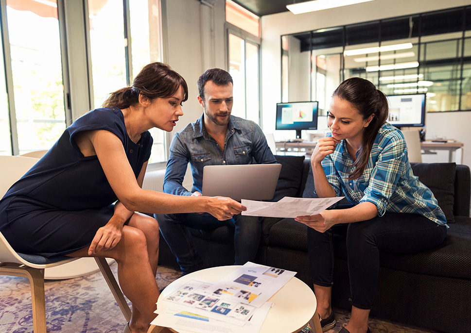 Three people working together