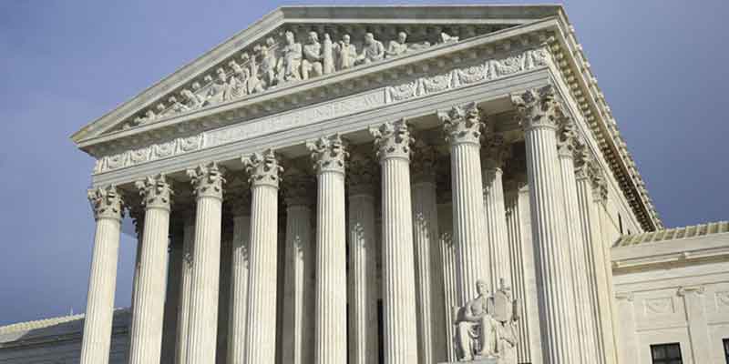 Majestic courthouse with stone pillars and statues