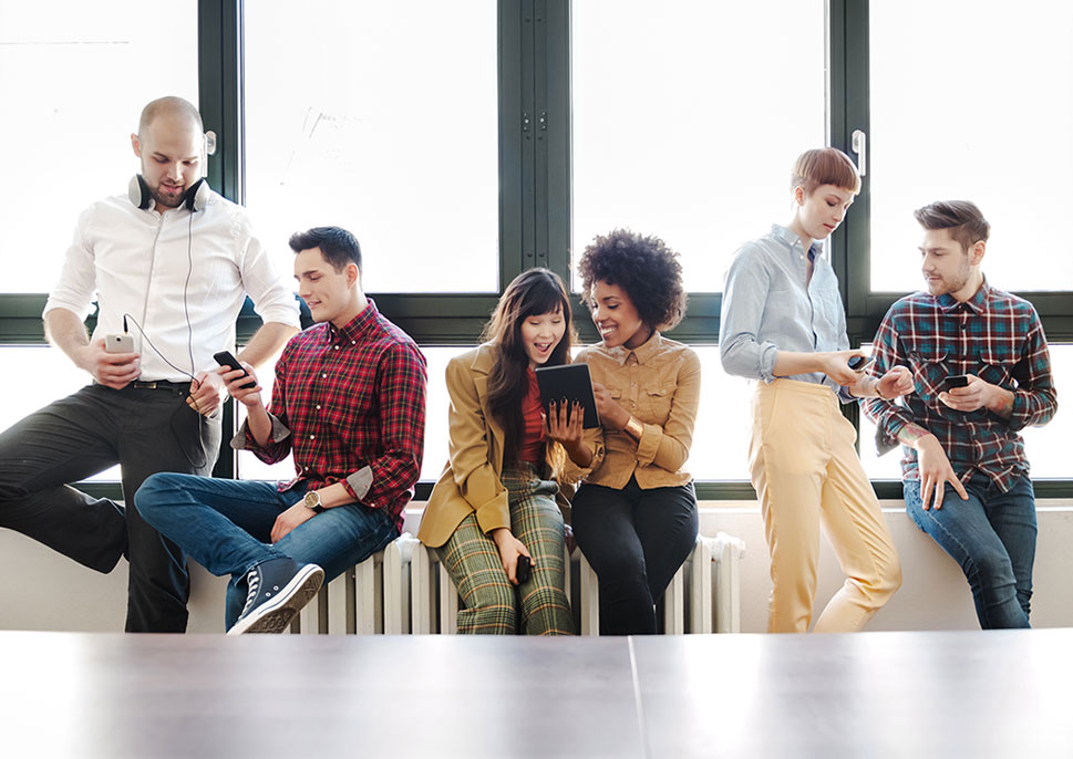 Young professional using electronic devices